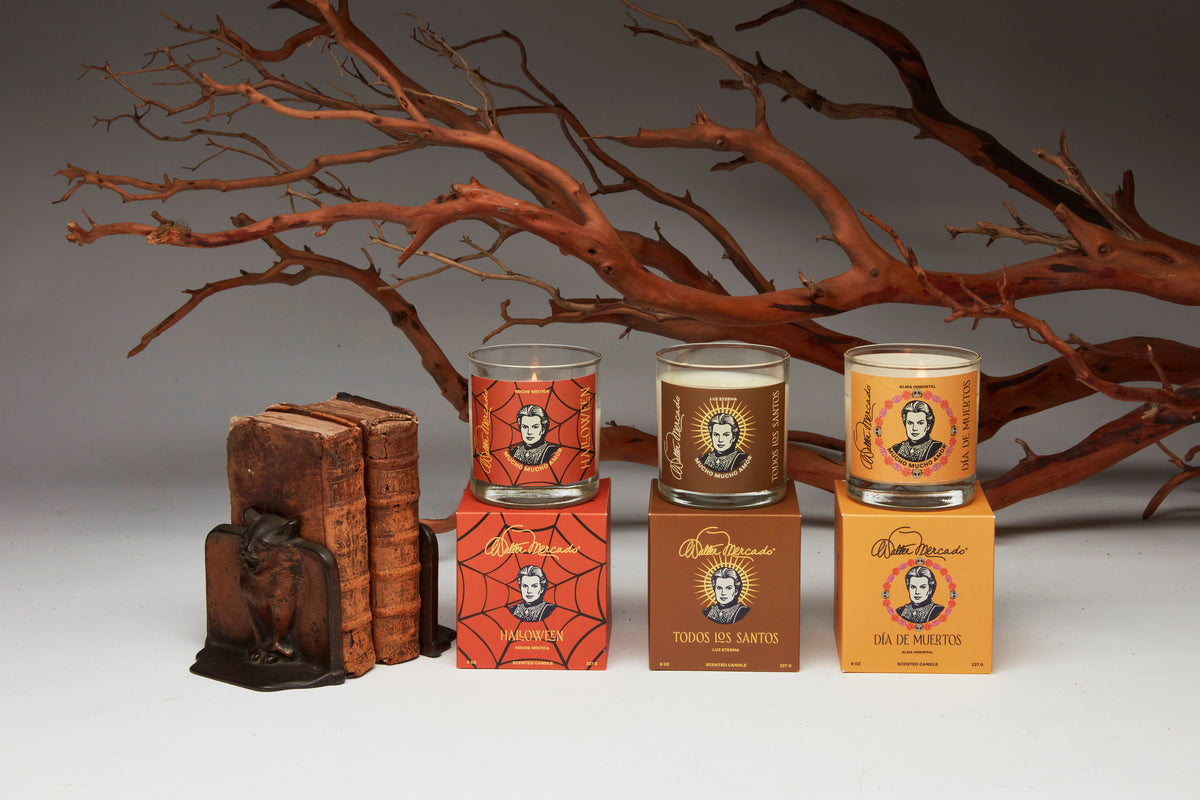 The three Walter Mercado seasonal candles displayed together with their individual boxes